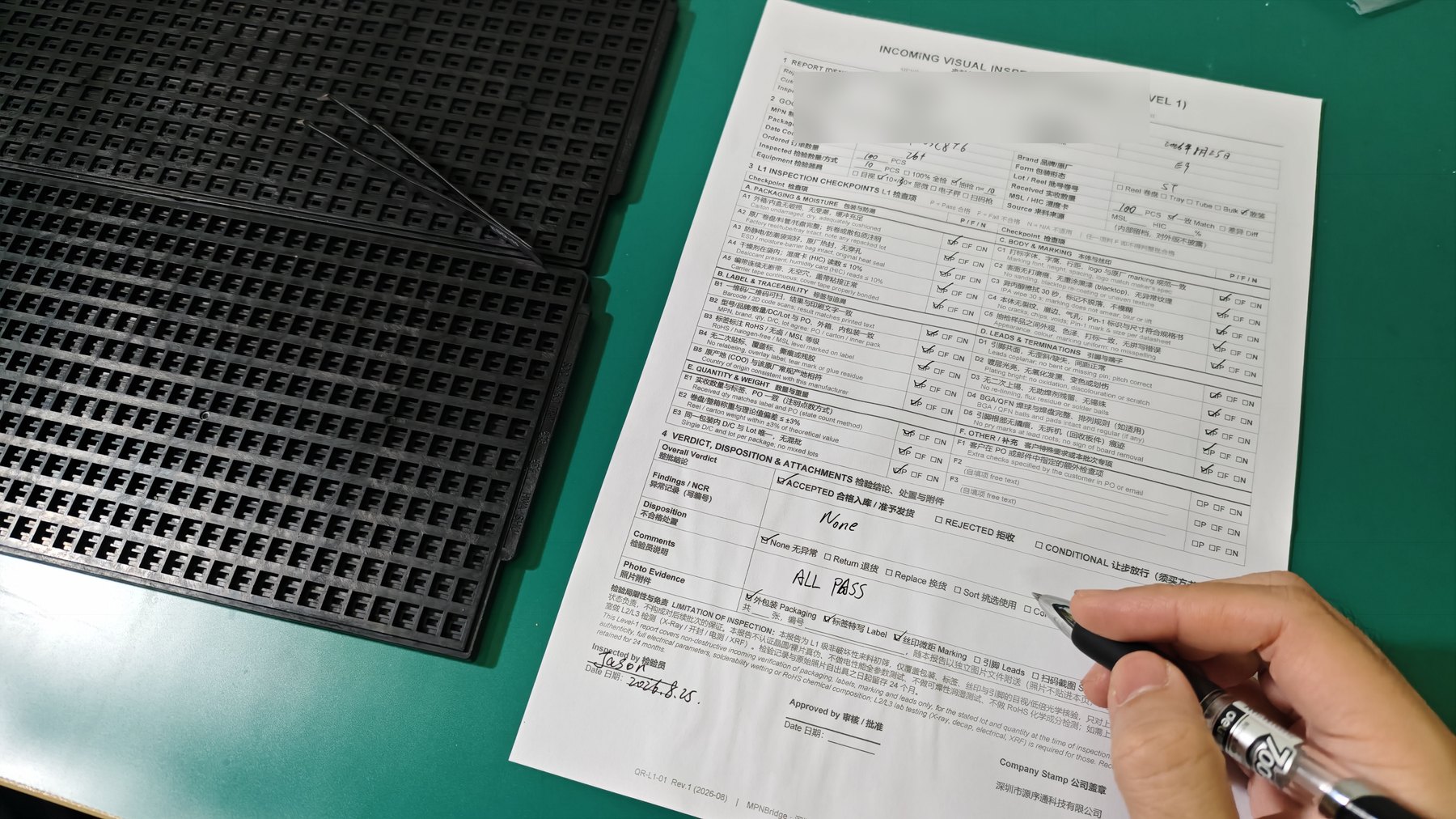 A completed and signed Level 1 incoming visual inspection report on the receiving bench, with the checkpoints ticked and the verdict recorded.